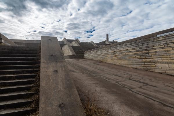 Concrete, bricks and steps leading to multiple pedestrianised spaces of the Linnahall, while allowing access for service vehicles