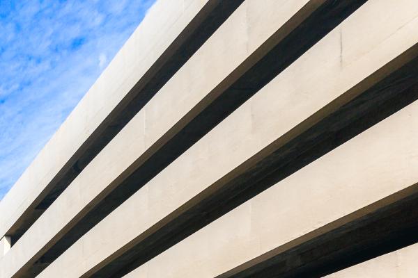 A cropped detail of the Hartshead Square car park showing the imperfections and textures of the concrete with harsh sunlight and deep shadows