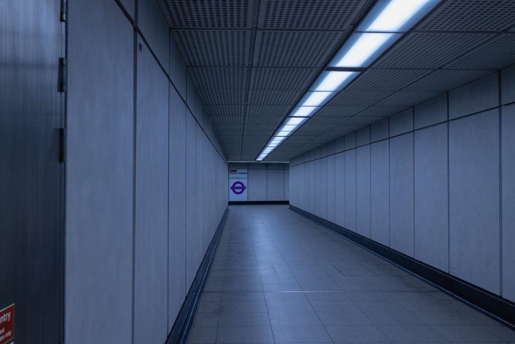 A liminal corridor at the boundary between the new and old parts of Tottenham Court station.